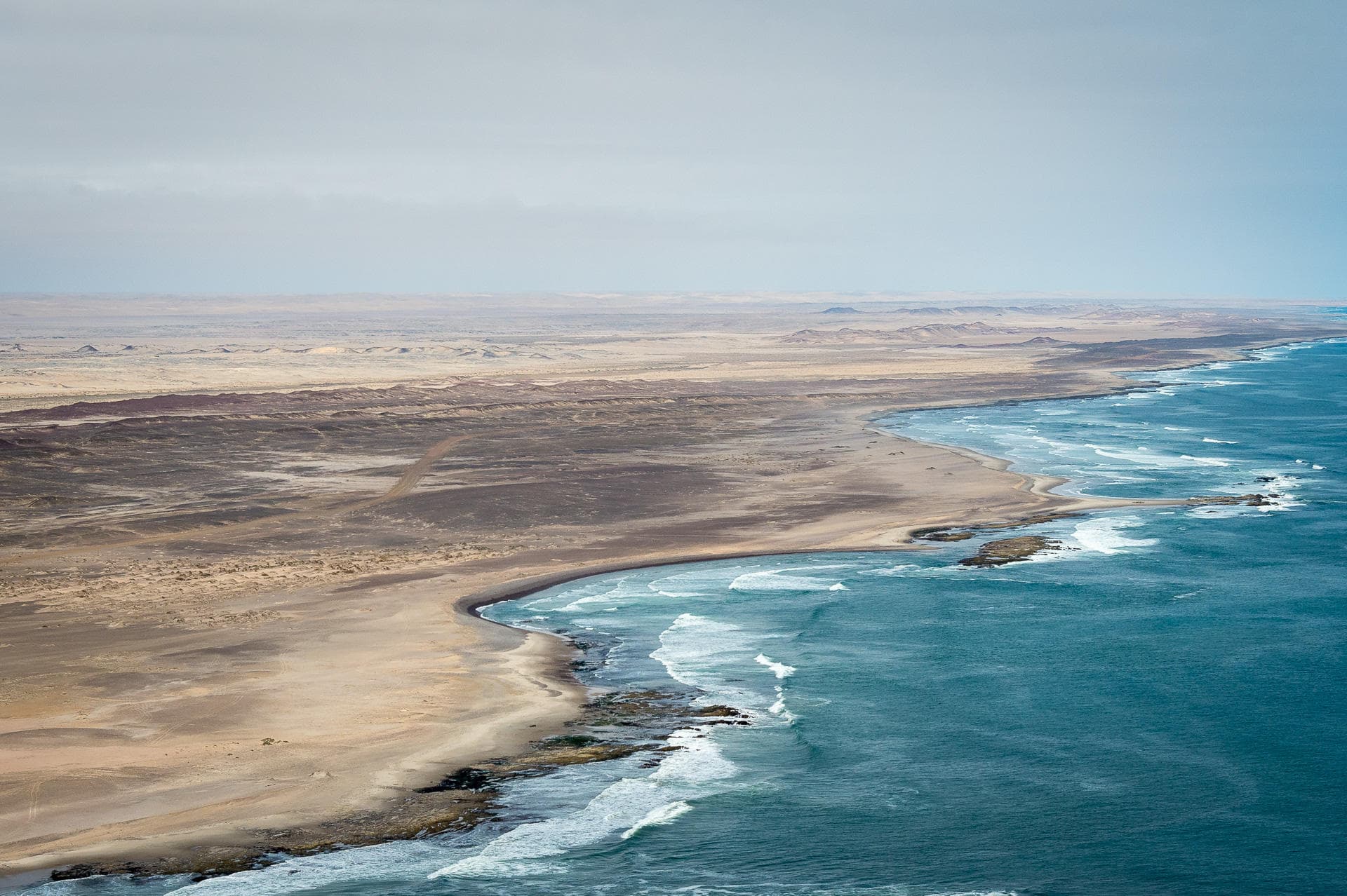 Aerial view of the Skeleton Coast where the Namib Desert meets the Atlantic Ocean