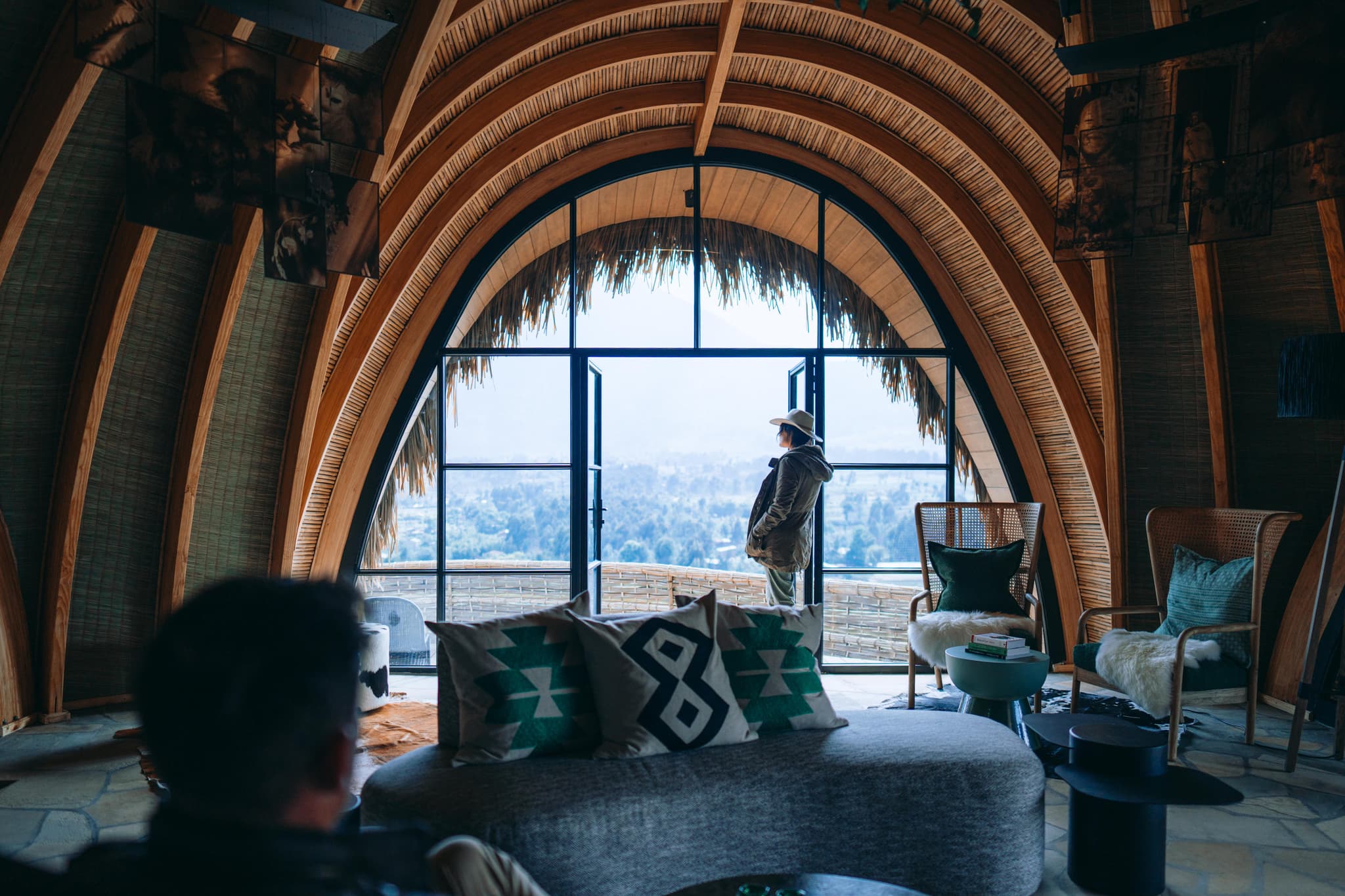 Arched bamboo villa interior with panoramic views at Wilderness Bisate
