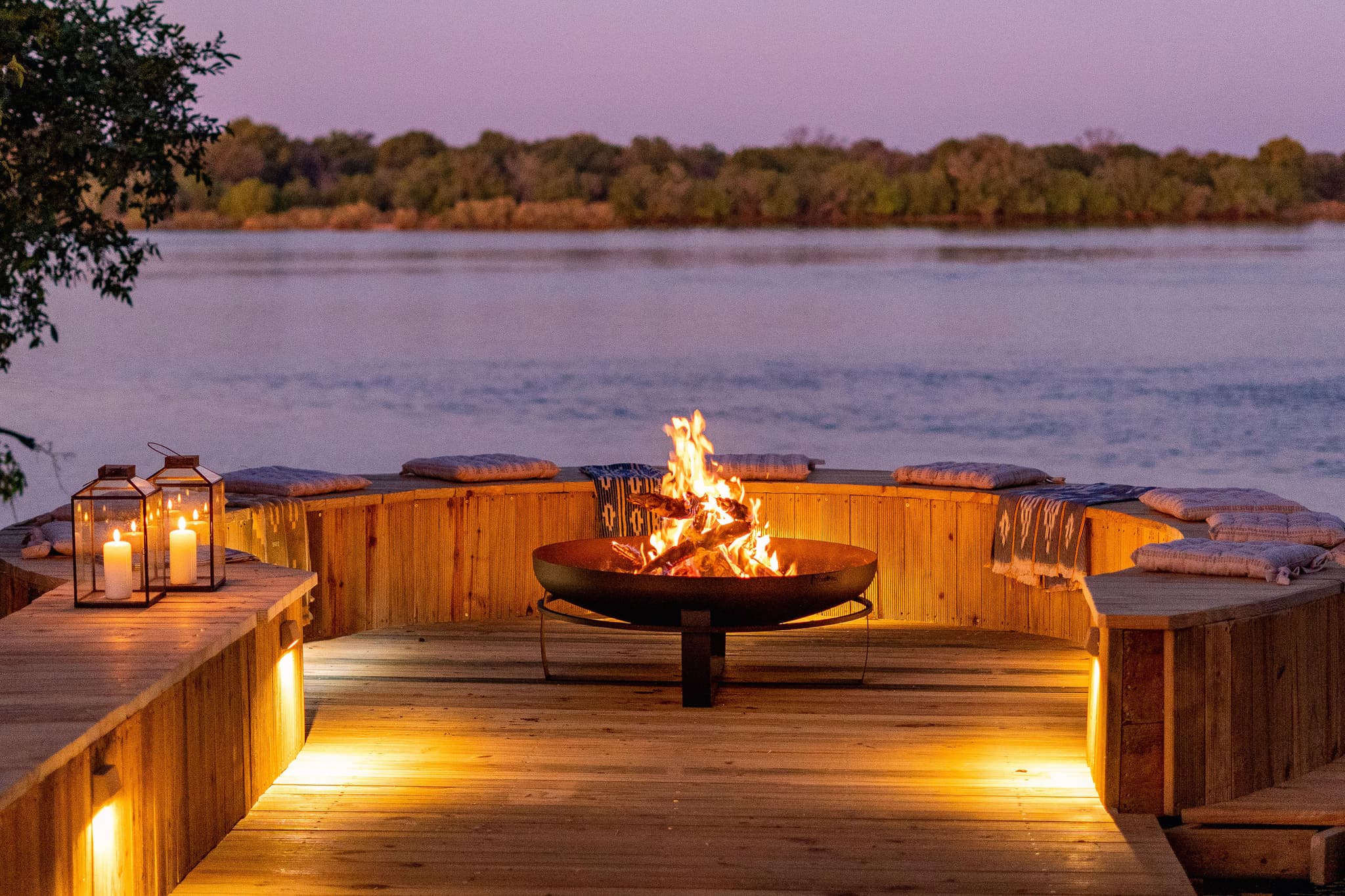 Riverside fire pit boma with lanterns at Victoria Falls River Lodge